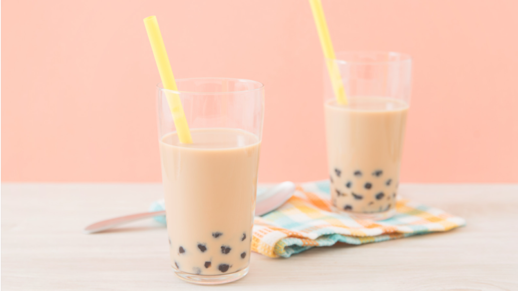 two milk tea bubble tea in a glass cup