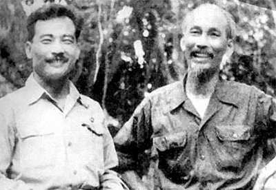 Black and white photograph of Souphanouvong and Ho Chi Minh smiling